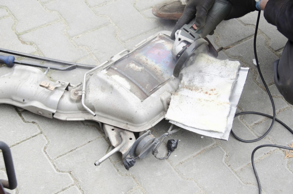 Photo of technician removing the DPF/EGR system on floor in our Coquitlam shop